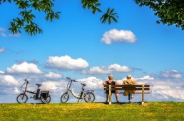 Couple on bench with bicycles