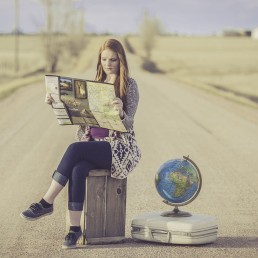lady with suitcase and map