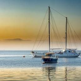 Yacht on the sea against sunset